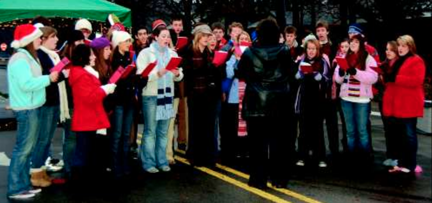 The high school’s Vocal Ensemble performs at the tree lighting Dec. 2. The high school band also entertained the crowd by playing a variety of holiday songs.